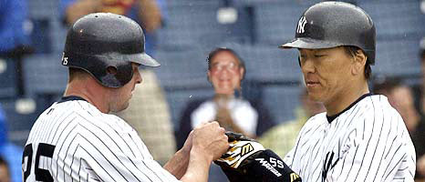 Hideki Matsui (right) is greeted by Jason Giambi after Matsui's two-run homer in the third.